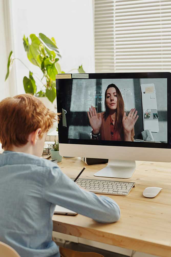 young student being taught online