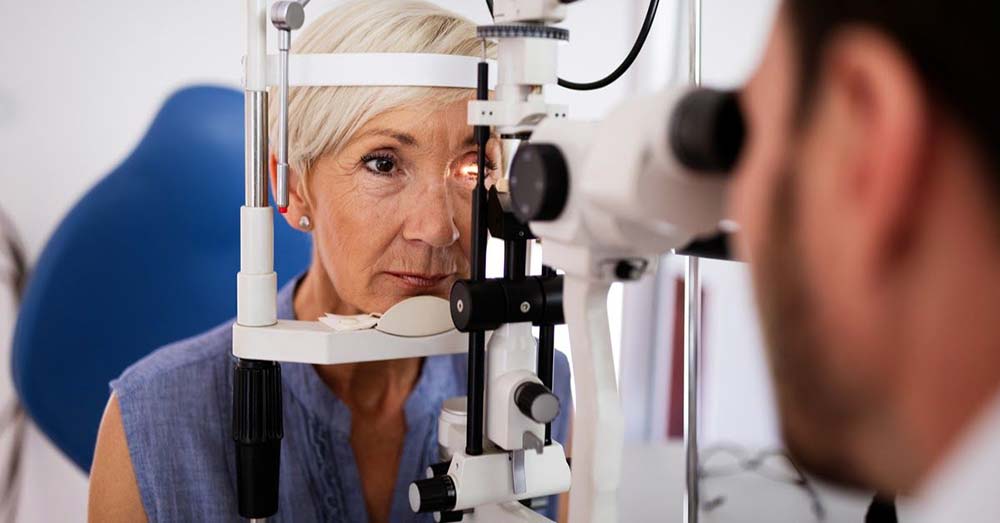 Elderly woman getting her eyes checked